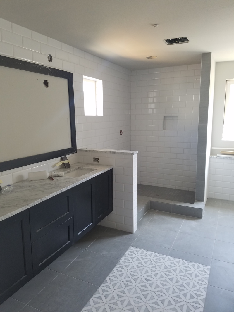 Walk-in shower, glass panels on order.